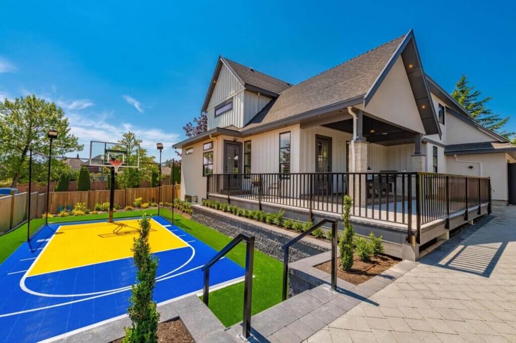 Example of a residential sport court design with a blue and yellow basketball court
